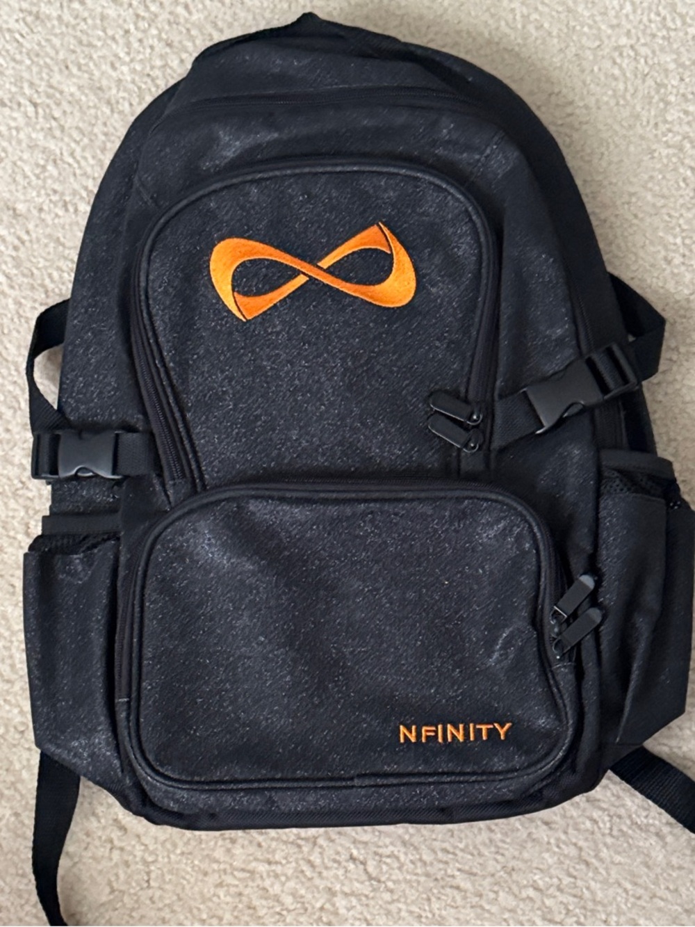 NFINITY Black Backpack with Orange Logo Accents